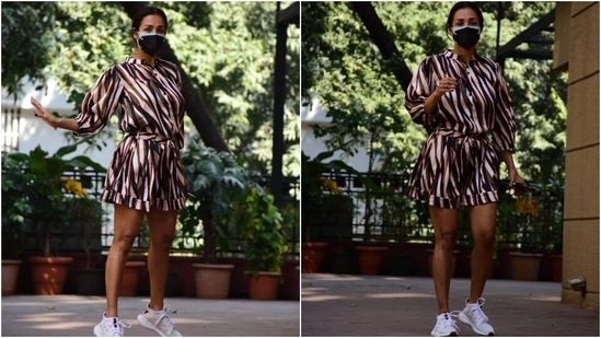 Malaika wore the ensemble with just a pair of chunky white sneakers and ditched all accessories to keep the look fuss-free. A centre-parted low bun rounded off the look. Additionally, the star wore two masks by wearing one on top of another to keep herself safe amid the ongoing Covid-19 pandemic. What do you think of Malaika's look?(HT Photo/Varinder Chawla)