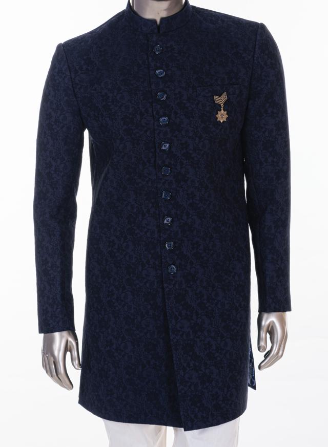 The sophisticated and rich self-design, well fitted, knee length achkan with a mandarin collar from MANYAVAR with white pencil pants will make you stand out in a crowd The sophisticated and rich self-design, well fitted, knee length achkan with a mandarin collar from MANYAVAR with white pencil pants will make you stand out in a crowd