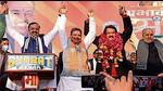 BJP candidate SP Singh Baghel (wearing garland) with Uttar Pradesh deputy chief minister Keshav Prasad Maurya and others after the announcement of his candidature for the UP polls. (HT Photo)