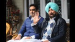 Former Congress minister Jagmohan Singh Kang (right) and his son at their residence in Chandigarh on Monday. (Ravi Kumar/HT)