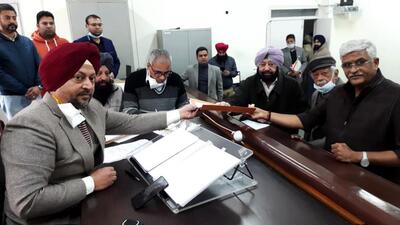 Punjab Lok Congress (PLC) president Capt Amarinder Singh filing his nomination papers in the presence of Union minister and BJP leader Gajendra Singh Shekhawat (extreme right) from the Patiala Urban assembly constituency on Monday. (ANI Photo) Punjab Lok Congress (PLC) president Capt Amarinder Singh filing his nomination papers in the presence of Union minister and BJP leader Gajendra Singh Shekhawat (extreme right) from the Patiala Urban assembly constituency on Monday. (ANI Photo)