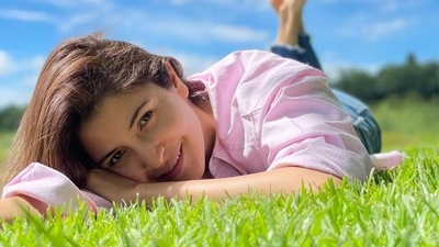 Anushka Sharma did not wear anything fancy for her day out relaxing on the lawn. She kept it comfy yet trendy in a basic pink shirt and denims. (Instagram/@anushkasharma)