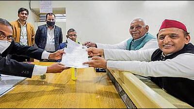 Samajwadi Party president Akhilesh Yadav handing over his nomination papers for the Uttar Pradesh assembly elections, in Mainpuri on Monday (HT PHOTO)