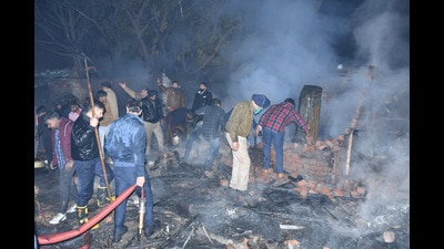 The charred remains of the shanties where a fire broke out in Sector 25, Chandigarh. (HT Photo)