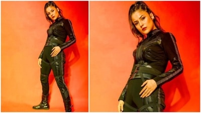 Today, January 31, Shehnaaz posted the photos on her official Instagram page with a fire emoticon as the caption. Her fierce look features a turtleneck top with front zipper, silver embellished and black faux leather band on the full sleeves, torso, and neckline. It also came with faux buckle detail on the waist and a bodycon silhouette, accentuating Shehnaaz's frame. (Instagram/@shehnaazgill)