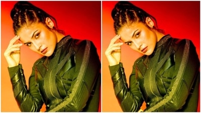 Shehnaaz styled the all-black outfit with black leather ankle-high boots and gold ear studs. She ditched accessories with the ensemble to keep the look fuss-free for her performance. A sleeked-back high ponytail with beaded hair accessories completed her hairdo. (Instagram/@shehnaazgill)