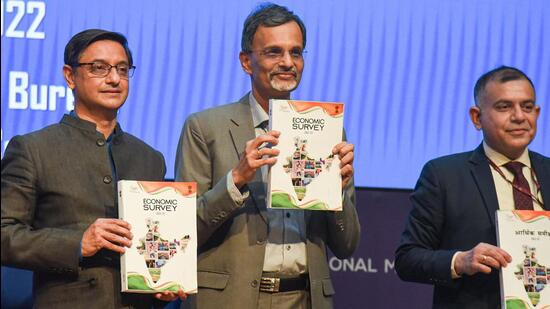 Chief Economic Advisor V Anantha Nageswaran along with Principal Economic Adviser Sanjeev Sanyal and Rajiv Mishra show the Economic Survey 2021-22, tabled in both the Houses of Parliament by Union Finance Minister Nirmala Sitharaman in New Delhi on Monday. (PTI PHOTO.)