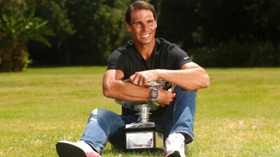 Men's singles champion Rafael Nadal of Spain poses for a photo with his trophy at Government House after the Australian Open in Melbourne,(AP)