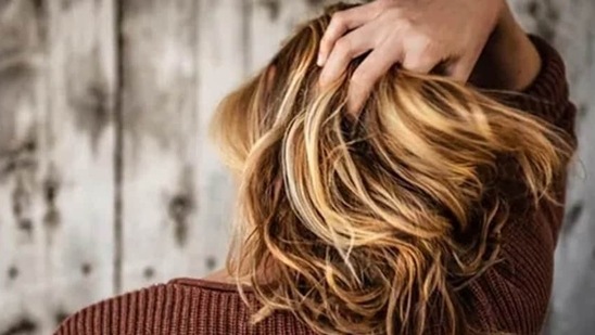 Looking for home remedies to get those luscious locks? Have a glass of hot water every day to prevent dry scalp and improve overall hair health.(Pixabay)