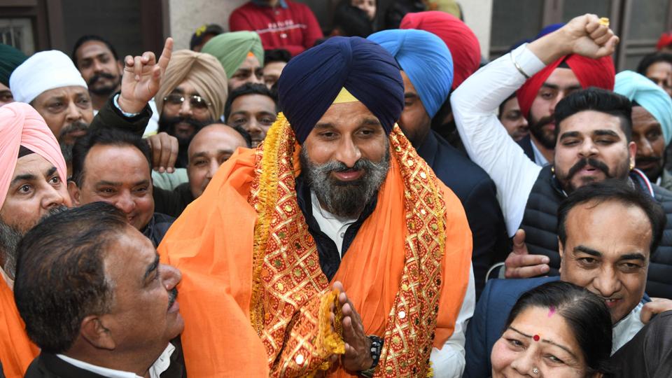 SAD party candidate Bikram Singh Majithia is surrounded by supporters during an election campaign event for the upcoming Punjab state assembly election, in Amritsar on Saturday. (AFP) SAD party candidate Bikram Singh Majithia is surrounded by supporters during an election campaign event for the upcoming Punjab state assembly election, in Amritsar on Saturday. (AFP)