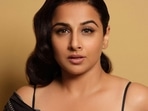Vidya Balan cuts a sensuous silhouette in <span class='webrupee'>₹</span>30k black rose cape set with a strappy leotard and silk pants (Instagram/balanvidya) Vidya Balan cuts a sensuous silhouette in <span class='webrupee'>₹</span>30k black rose cape set with a strappy leotard and silk pants (Instagram/balanvidya)