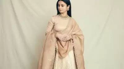 It was teamed with a soft brown lehenga that sported intricate embroidery all over with geometric designs and a three-dimensional view to enhance the rich look and was layered with a ravishing organza dupatta that featured contemporary artistry. (Instagram/rasikadugal) It was teamed with a soft brown lehenga that sported intricate embroidery all over with geometric designs and a three-dimensional view to enhance the rich look and was layered with a ravishing organza dupatta that featured contemporary artistry. (Instagram/rasikadugal)