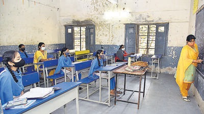Students follow Covid-19 protocols while attending a class at Government High school, at Musheerabad, in Hyderabad on Tuesday. (ANI) Students follow Covid-19 protocols while attending a class at Government High school, at Musheerabad, in Hyderabad on Tuesday. (ANI)