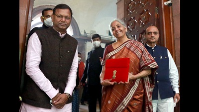 Union Finance Minister Nirmala Sitharaman along with the Ministers of State for Finance Pankaj Chaudhary and Bhagwat Karad arrives at Parliament ahead of the Union Budget 2022-23 presentation in Lok Sabha, in New Delhi on Tuesday. (Amlan Paliwal)
