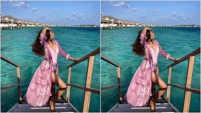 Malavika styled the beach outfit with statement rose-shaped gold earrings, layered bracelets, and a gold anklet. Her glam picks include open locks, mauve-toned lip shade, blushed cheeks, and mascara-adorned lashes. (Instagram/@malavikamohanan_) Malavika styled the beach outfit with statement rose-shaped gold earrings, layered bracelets, and a gold anklet. Her glam picks include open locks, mauve-toned lip shade, blushed cheeks, and mascara-adorned lashes. (Instagram/@malavikamohanan_)