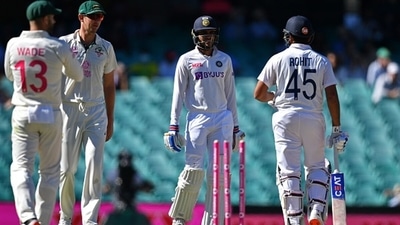 Shubman Gill with Rohit Sharma as the Australians look on. (Getty) Shubman Gill with Rohit Sharma as the Australians look on. (Getty)