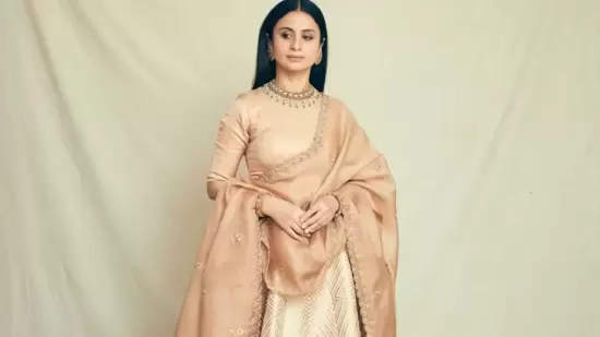 Leaving her luscious straight tresses open down her back in mid-parted hairstyle, Rasika accessorised her look with a pair of exquisite earrings, a choker necklace and a gold kada bangle in each hand from Shri Paramani Jewels.&nbsp;(Instagram/rasikadugal)