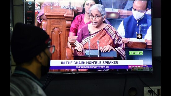 A man watches the live telecast of Union Budget 2022-23 presentation by Union finance minister Nirmala Sitharaman, New Delhi on Tuesday (Rahul Singh)