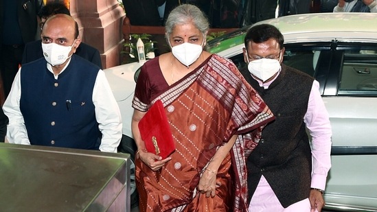 Union finance minister Nirmala Sitharaman with minister of state for finance Bhagwat Karad (Left) arrives at Parliament to table the Union Budget 2022.&nbsp;(ANI Photo)