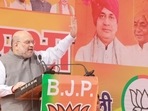 Union home minister Amit Shah addressing a gathering in Atrauli assembly constituency of Aligarh on Wednesday. (HT photo)