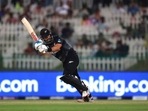 New Zealand's batsman Daryl Mitchell watches his shot during the Cricket Twenty20 World Cup semi-final match between England and New Zealand in Abu Dhabi. New Zealand's batsman Daryl Mitchell watches his shot during the Cricket Twenty20 World Cup semi-final match between England and New Zealand in Abu Dhabi.
