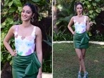 Actor Ananya Panday looks chic in bottle green leather skirt.