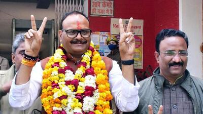 Uttar Pradesh law minister Brajesh (wearing garland) flashes the victory sign before filing his nomination in Lucknow on Wednesday. (ANI PHOTO) Uttar Pradesh law minister Brajesh (wearing garland) flashes the victory sign before filing his nomination in Lucknow on Wednesday. (ANI PHOTO)