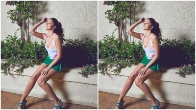 Ananya paired a slip-in floral cropped white top with a leather green short skirt. (Instagram/@ananyapanday)
