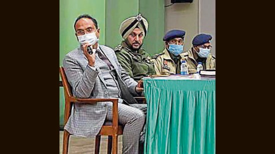 The returning officers briefed election observers regarding their respective assembly constituencies during the meet in Ludhiana. (HT Photo)