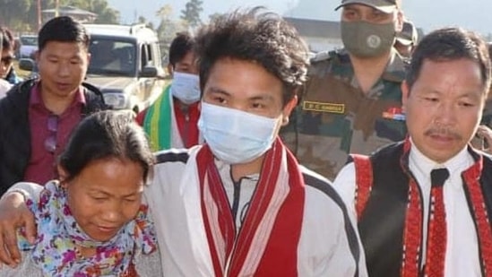 Miram Taron (centre) with his parents at Tuting in Arunachal Pradesh on Monday. (PHOTO: Spear Corps-Indian Army .)