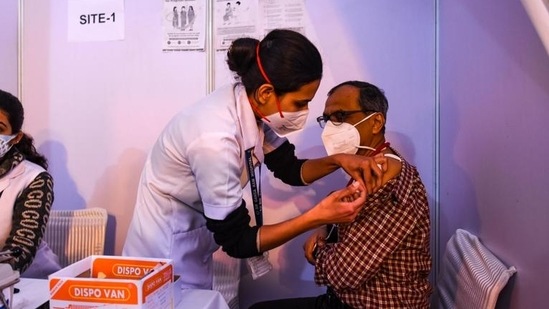 A doctor being inoculated with a booster dose of Covid-19 vaccine, at Ganga Ram Hospital, in New Delhi. (Amal KS/HT Photo)