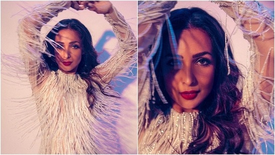 Malaika teams the dress with bold red lips. Malaika teams the dress with bold red lips. 