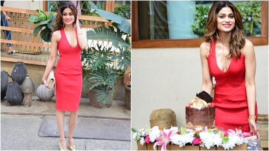 Shamita's bright red dress features a plunging V neckline, ribbed pattern done in vertical and criss-cross design, bodycon silhouette, and halter straps. The birthday girl accessorised her look with a nude shoulder bag, and gold pointed sandals.(HT Photo/Varinder Chawla)