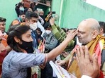 Union Home Minister Amit Shah during the door-to-door campaigning ahead of the upcoming Uttar Pradesh Elections 2022, in Mathura on Thursday. (ANI)