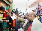 When Union home minister Amit Shah and the party’s national president JP Nadda hit the road, local leaders commended their spirit. (PTI) When Union home minister Amit Shah and the party’s national president JP Nadda hit the road, local leaders commended their spirit. (PTI)