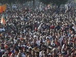 People listen to Uttar Pradesh chief minister Yogi Adityanath at an election rally at Dhaulana in Hapur district on January 30. (AP)