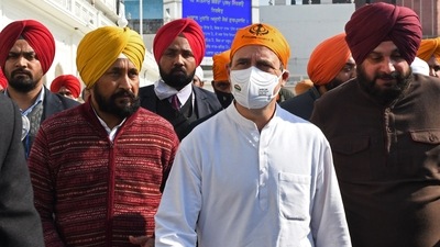 Rahul Gandhi with Punjab chief minister Charanjit Channi and state Congress chief Navjot Singh Sidhu. (AFP Photo) Rahul Gandhi with Punjab chief minister Charanjit Channi and state Congress chief Navjot Singh Sidhu. (AFP Photo)