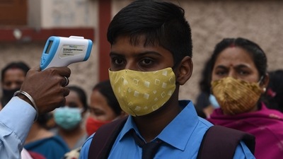 A student undergoes thermal screening at Scottish Church Collegiate School in Kolkata, West Bengal. (HT Photo/Samir Jana) A student undergoes thermal screening at Scottish Church Collegiate School in Kolkata, West Bengal. (HT Photo/Samir Jana)
