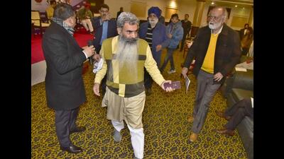 Cabinet minister Bharat Bhushan Ashu leaving the function organised by Ludhiana Management Association (LMA) after a spat with panellists, in Ludhiana on Thursday. (Gurpreet Singh/HT)