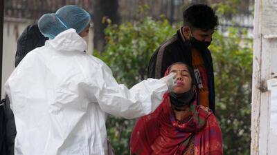 A woman getting sampled for Covid testing at the Sector-45 civil hospital in Chandigarh on Thursday. (Ravi Kumar/HT)