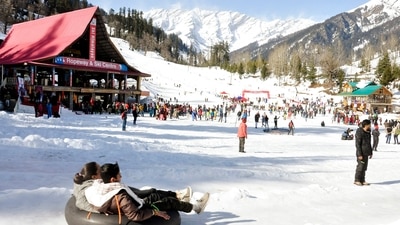 Tourists enjoy at a ski centre after the snowfall in Himachal Pradesh's Manali on Monday. (ANI Photo) Tourists enjoy at a ski centre after the snowfall in Himachal Pradesh's Manali on Monday. (ANI Photo)