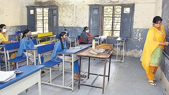 File photo of students following Covid-19 protocols while attending a class at a government in Hyderabad. File photo of students following Covid-19 protocols while attending a class at a government in Hyderabad.