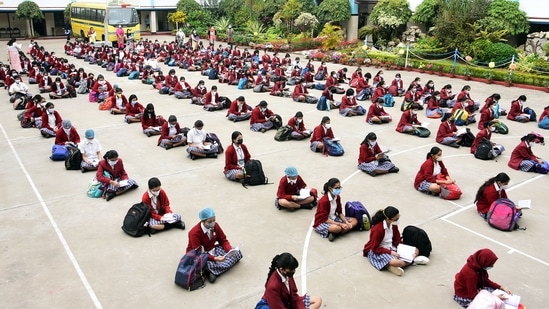 Students attend classes outdoors in the school premises as they maintain social distancing and following other Covid-19 protocols.(ANI)