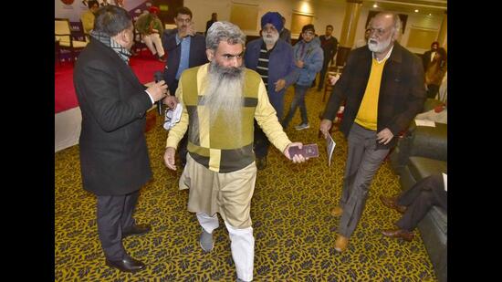 Cabinet minister Bharat Bhushan Ashu leaving the function organised by Ludhiana Management Association (LMA) after a spat with panellists, in Ludhiana on Thursday. (Gurpreet Singh/HT)