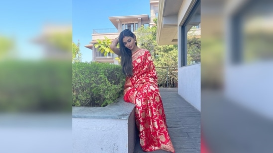 The newlywed bride, who often keeps her fans updated with all her doings, took to her Instagram handle to share pictures in her red saree and captioned it, "The morning after…."(Instagram/@imouniroy)