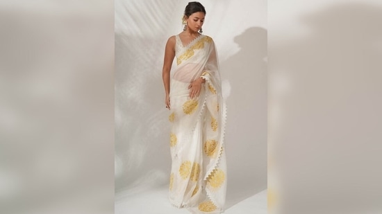 Alia Bhatt's saree features a timeless ivory silk organza drape adorned with resham and patra embroidery.(Devnaagri)