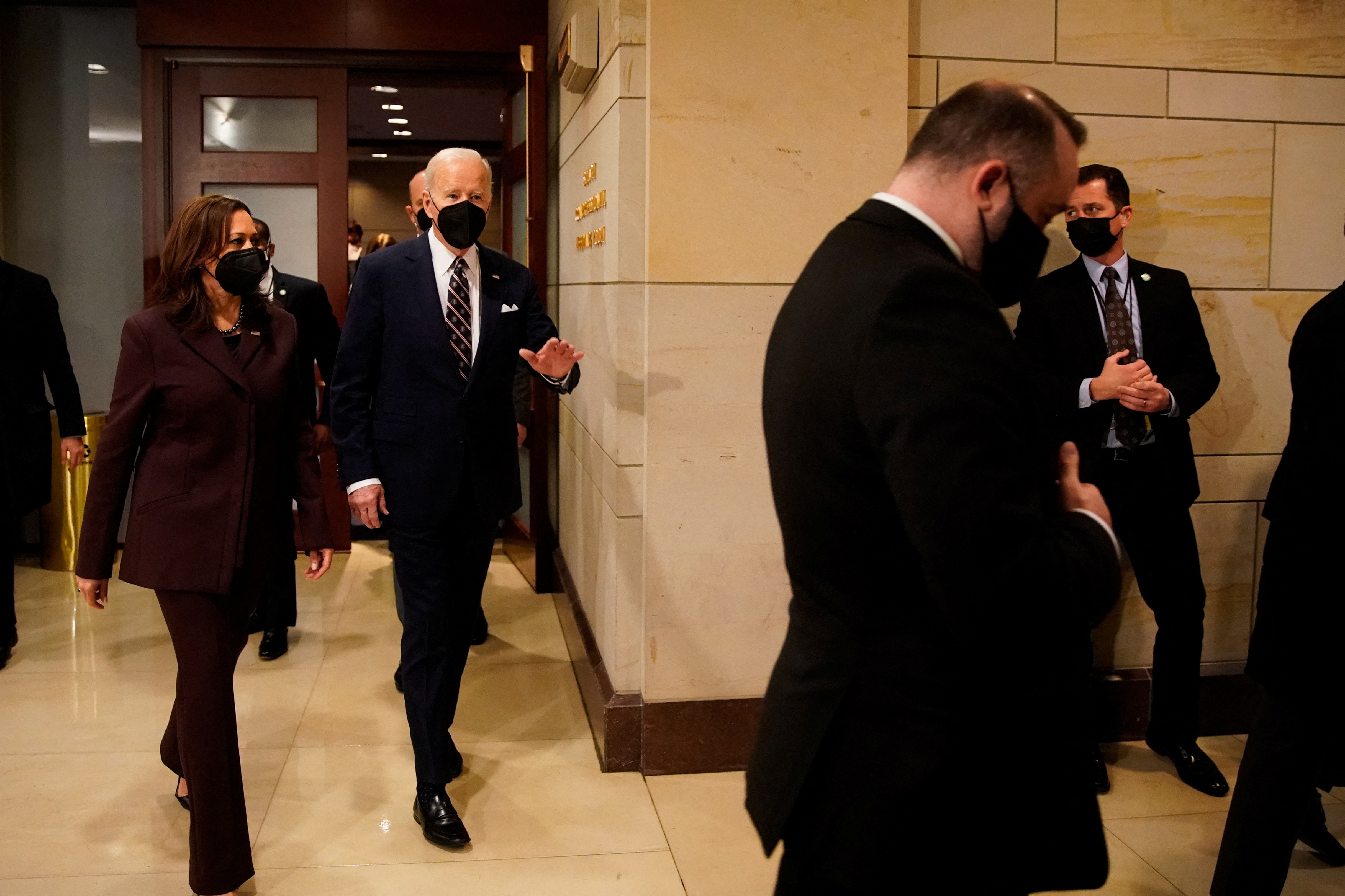 US President Joe Biden and Vice President Kamala Harris walk to the 70th National Prayer Breakfast at the US Capitol in Washington on Thursday. (REUTERS)