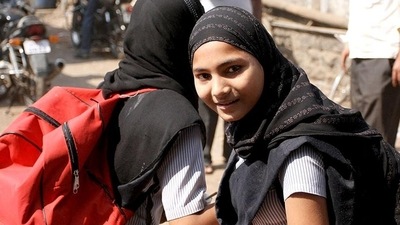 A class 12 board girl student was allegedly misbehaved and scolded while taking her board exam while wearing a hijab. (Shutterstock Photo)