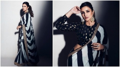 Parineeti Chopra is all set to make heads turn on the show Hunarbaaz Desh ki Shaan donning a stunning black and ivory stripes saree by ace designer Masaba Gupta. (Instagram/@parineetichopra) Parineeti Chopra is all set to make heads turn on the show Hunarbaaz Desh ki Shaan donning a stunning black and ivory stripes saree by ace designer Masaba Gupta. (Instagram/@parineetichopra)