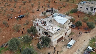 A building destroyed in the aftermath of a counter-terrorism mission conducted by the US Special Operations Forces is seen in Atmeh, Syria. (VIA REUTERS)